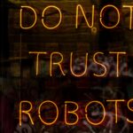 néons jaune safran formant la phrase do not trust robots