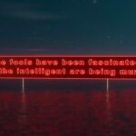 panneaux lettres rouges lumineux texte "the fools have been fascinated, now the intelligent are beingmuzzled"